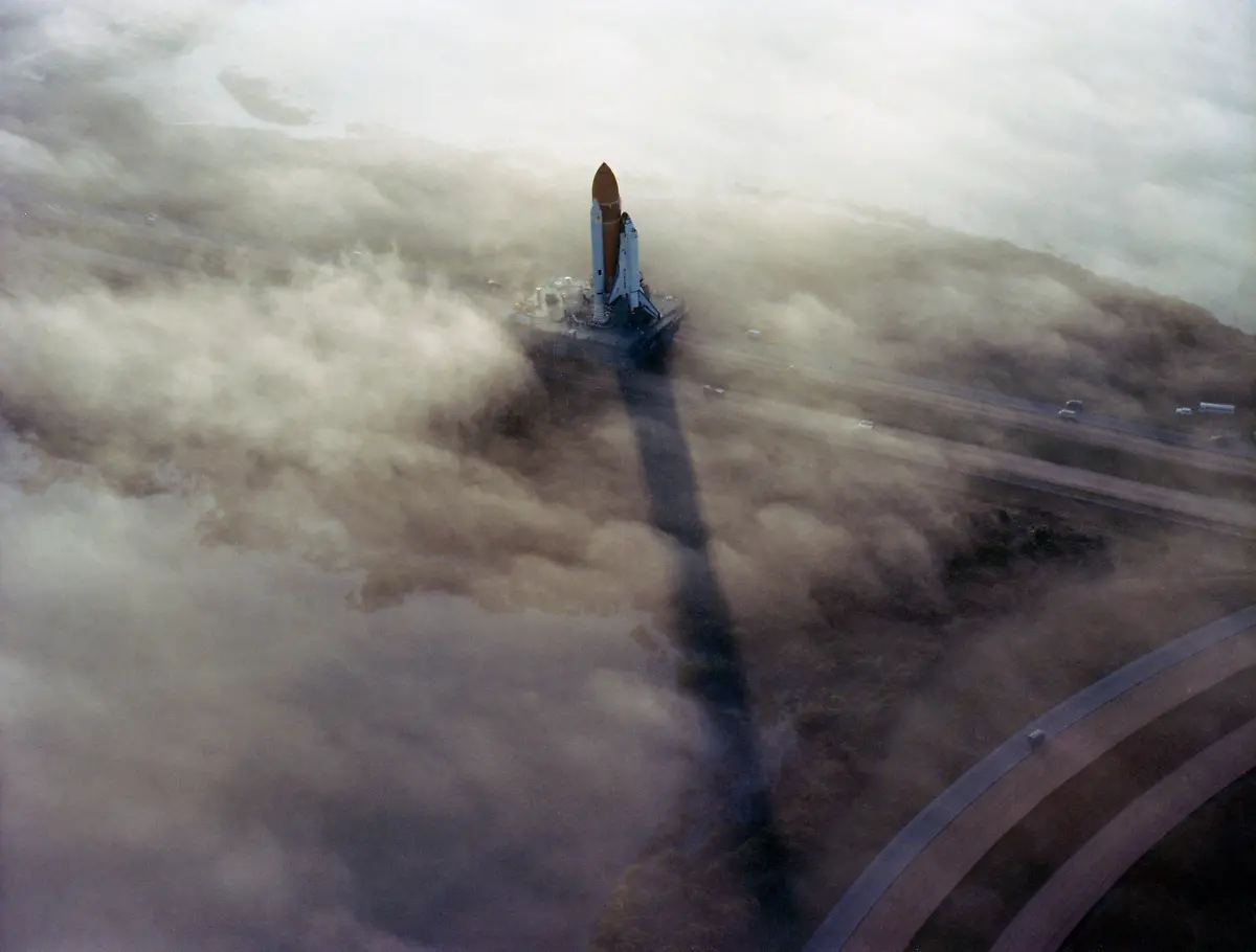 the-Challenger-STS-6-being-Rolled-Out-to-Pad-39A-in-the-morning-fog-11-30-1982-1062-38-M-11586