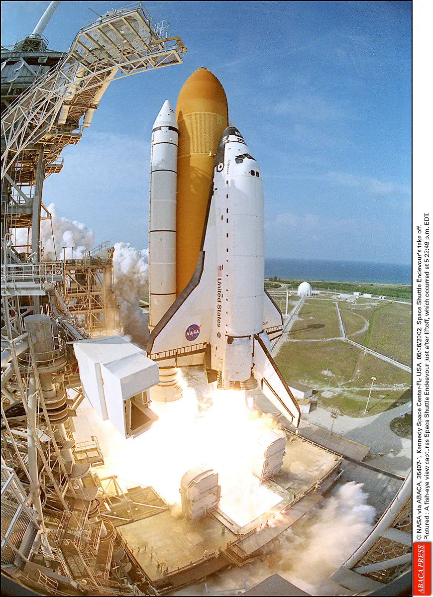 35407-01-NASA-via-ABACA-35407-1-Kennedy-Space-Center-FL-USA-05-06-2002-Space-Shuttle-Endevour-s-take-off-Pictured-A-fish-eye-view-captures-Space-Shuttle-Endeavour-just-after-liftoff-which-occurred-at-5-22-49-p-m-EDT