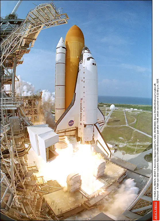 35407-01-NASA-via-ABACA-35407-1-Kennedy-Space-Center-FL-USA-05-06-2002-Space-Shuttle-Endevour-s-take-off-Pictured-A-fish-eye-view-captures-Space-Shuttle-Endeavour-just-after-liftoff-which-occurred-at-5-22-49-p-m-EDT