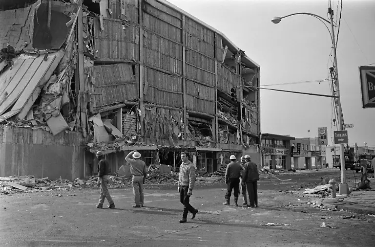 Firefighters-intervene-on-a-damaged-building-on-March-30-1964-in-Anchorage-Alaska-after-the-March-27-1964-earthquake-that-left-131-victims-and-caused-a-tsunami-that-killed-14-people-in-California-and-caused-damage-across-the-entire-American-west-coast-The-1964-earthquake-in-Alaska-is-one-of-the-most-powerful-earthquakes-ever-recorded-in-the-world-with-a-magnitude-9-2-between-9-1-and-9-3-on-the-Richter-scale-and-the-second-largest-earthquake-after-an-M9-5-earthquake-in-Chile-in-1960