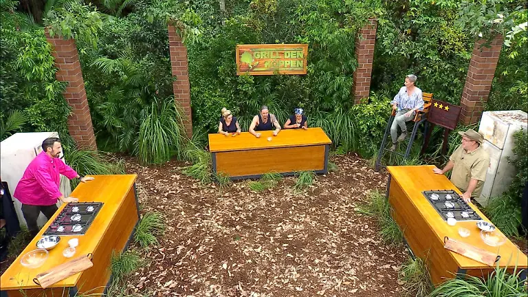 ACHTUNG-SPERRFRIST-FUeR-ALLE-MEDIEN-BIS-ZUM-SHOWENDE-MITTWOCH-28-JANUAR-2026-22-30-UHR-Ariel-l-Gil-Ofarim-und-Eva-Benetatou-in-der-Dschungelpruefung-Grill-den-Koeppen-Sie-kommen-als-Jury-in-den-Genuss-die-Gerichte-von-Starkoch-Jan-Steffen-Koeppen-und-Ranger-Matt-r-zu-verkosten-Sonja-Zietlow-2-v-r-hat-das-Ganze-im-Blick-Die-Verwendung-des-sendungsbezogenen-Materials-ist-nur-mit-dem-Hinweis-und-Verlinkung-auf-RTL-gestattet