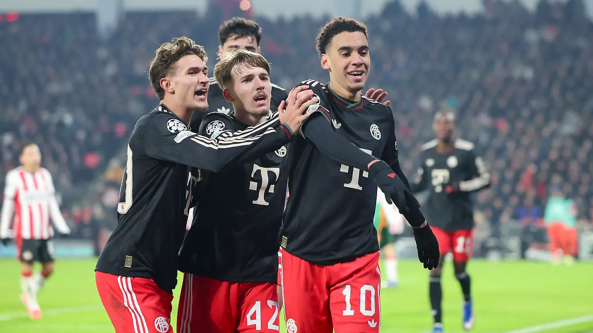 Jamal-Musiala-FC-Bayern-Muenchen-bejubelt-seinen-Treffer-zum-0-1-mit-Tom-Bischof-FC-Bayern-Muenchen-und-Lennart-Karl-FC-Bayern-Muenchen-UEFA-Champions-League-2025-26-League-Phase-MD8-PSV-Eindhoven-v-FC-Bayern-Muenchen-PSV-Stadion-am-28-January-2026-in-Eindhoven-Niederlande-Foto-von-Marco-Steinbrenner-DeFodi-Images-Jamal-Musiala-FC-Bayern-Muenchen-celebrates-after-scoring-his-teams-first-goal-with-Tom-Bischof-FC-Bayern-Muenchen-and-Lennart-Karl-FC-Bayern-Muenchen-UEFA-Champions-League-2025-26-League-Phase-MD8-PSV-Eindhoven-v-FC-Bayern-Muenchen-PSV-Stadion-January-28-2026-in-Eindhoven-Netherlands