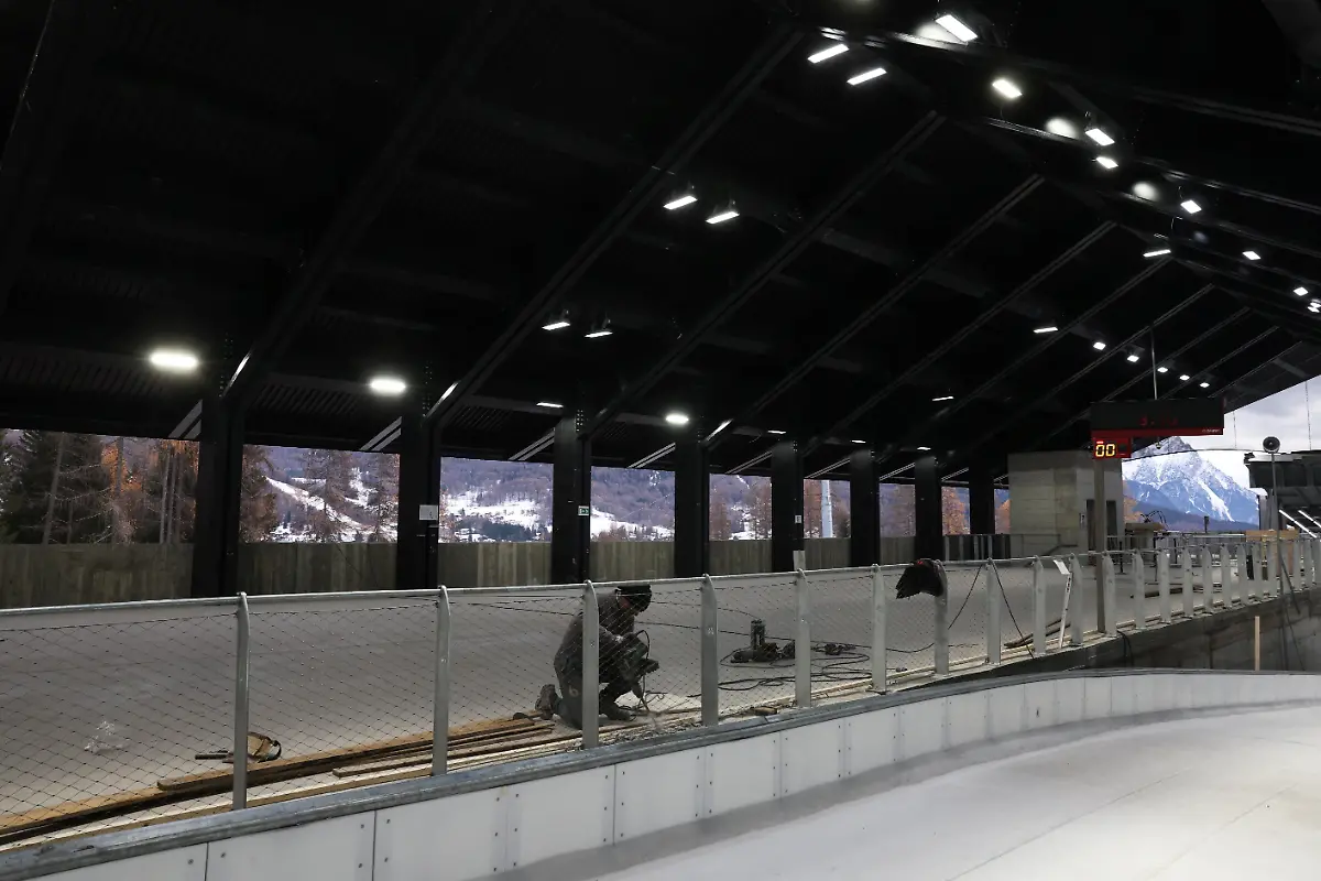A-man-works-at-Cortina-Sliding-Centre-track-start-house-ahead-of-Milano-Cortina-Winter-Olympics-2026-in-Cortina-d-Ampezzo-Italy-December-4-2025