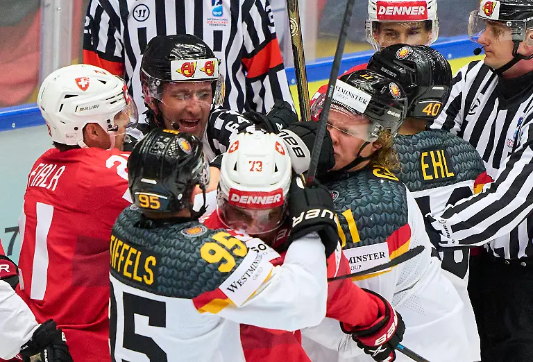 Kevin-Fiala-21-of-Switzerland-fights-with-Korbinian-Geibel-11-of-Germany-in-the-preliminary-round-match-SWITZERLAND-GERMANY-of-the-IIHF-Ice-hockey-Eishockey-World-Championship-WM-Weltmeisterschaft-Group-B-in-Jyske-Bank-Arena-in-Herning-Denmark-May-15-2025