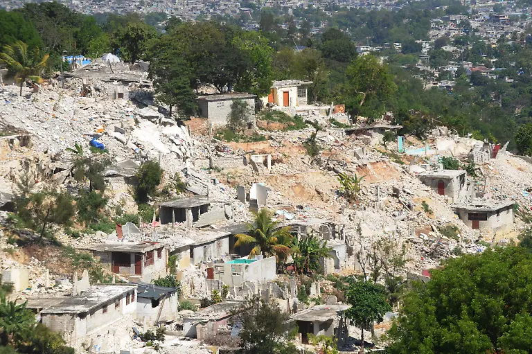 A-view-of-a-suburb-of-Port-au-Prince-Canape-Vert-is-shown-devastated-on-April-8-2010-after-the-earthquake-on-January-12-2010-The-UN-will-move-8-000-Haitians-out-of-a-makeshift-camp-to-a-new-site-almost-three-months-after-a-huge-quake-ravaged-the-country-officials-said-Wednesday-but-many-more-remain-at-risk-as-the-rainy-season-approaches