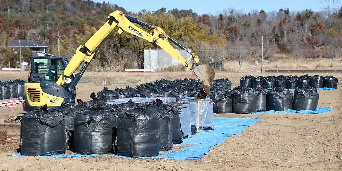 Flexible-container-bags-of-surface-soil-that-was-removed-during-decontamination-work-are-pictured-in-specified-return-residence-zone-in-Okuma-Town-Fukushima-Prefecture-on-Feb-13-2024