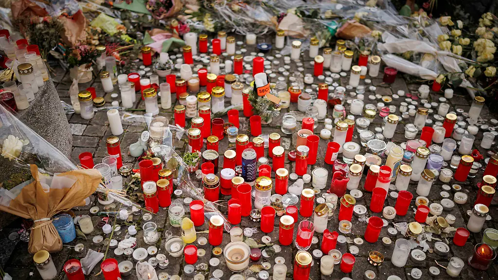 Candles-are-pictured-as-approximately-a-thousand-people-gathered-to-pay-tribute-to-the-victims-of-the-tragedy-in-Crans-Montana-and-to-call-for-justice-and-truth-Saturday-January-31-2026-in-Lutry-Switzerland-40-people-mostly-teenagers-lost-their-lives-and-116-were-severely-injured-in-the-fire-at-the-bar-Le-Constellation-on-New-Year-s-celebration-in-the-Swiss-Alps-resort-of-Crans-Montana