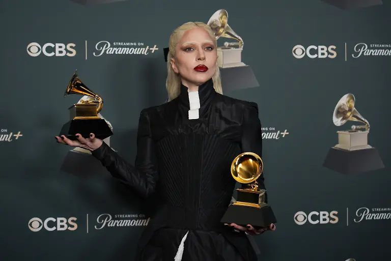 Lady-Gaga-poses-in-the-press-room-with-the-awards-for-best-pop-vocal-album-for-Mayhem-and-best-dance-pop-recording-for-Abracadabra-during-the-68th-annual-Grammy-Awards-on-Sunday-Feb-1-2026-in-Los-Angeles