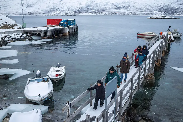 Locals-walk-on-the-dock-in-Kapisillit-Greenland-January-21-2026-The-concept-that-ownership-is-shared-collectively-is-central-to-the-Inuit-identity-It-has-survived-300-years-of-colonisation-and-is-written-into-law-People-can-own-houses-but-not-the-land-beneath-them-We-can-t-even-buy-our-own-land-ourselves-but-Trump-wants-to-buy-it-that-s-so-strange-to-us-said-village-catechist-Kaaleeraq-Ringsted-74-REUTERS-Marko-Djurica-SEARCH-DJURICA-GREENLAND-INUIT-FOR-THIS-STORY-SEARCH-WIDER-IMAGE-FOR-ALL-STORIES
