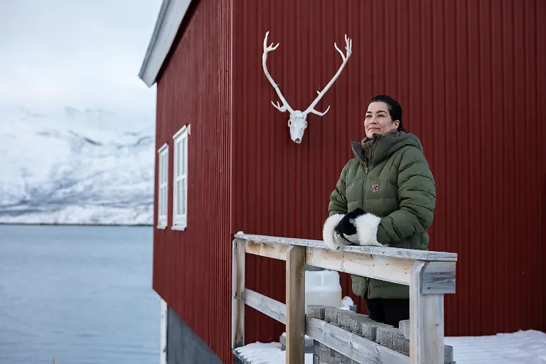 Village-leader-Heidi-Lennert-Nolso-poses-for-a-photo-in-front-of-her-house-in-Kapisillit-Greenland-January-20-2026-The-concept-that-ownership-is-shared-collectively-is-central-to-the-Inuit-identity-It-has-survived-300-years-of-colonisation-and-is-written-into-law-People-can-own-houses-but-not-the-land-beneath-them-We-ve-always-had-a-free-life-here-in-nature-said-Nolso-We-can-sail-and-go-anywhere-without-restrictions-REUTERS-Marko-Djurica-SEARCH-DJURICA-GREENLAND-INUIT-FOR-THIS-STORY-SEARCH-WIDER-IMAGE-FOR-ALL-STORIES