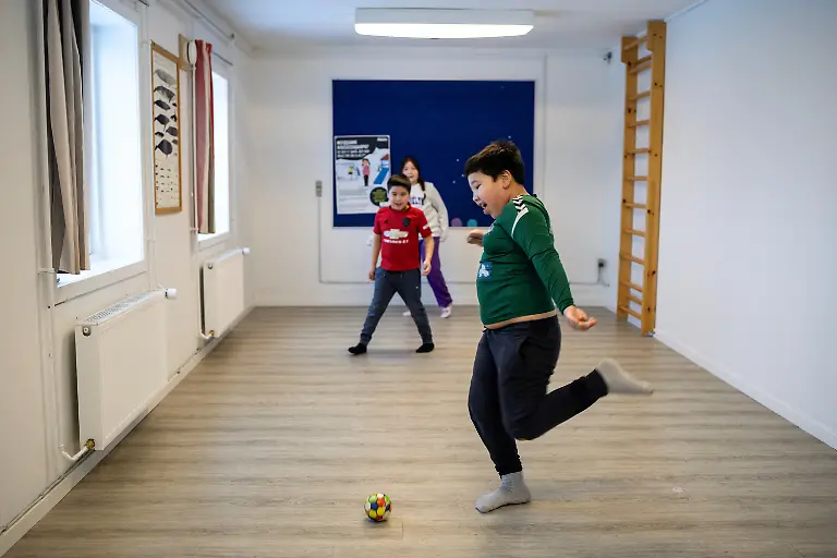 William-right-8-Malerak-7-and-Viola-7-play-soccer-in-their-school-in-Kapisillit-Greenland-January-20-2026-At-the-school-these-are-the-only-three-remaining-students-studying-beneath-a-map-of-Greenland-printed-in-1954-During-recess-they-go-sledding-All-three-are-moving-away-soon-and-the-school-may-close-REUTERS-Marko-Djurica-SEARCH-DJURICA-GREENLAND-INUIT-FOR-THIS-STORY-SEARCH-WIDER-IMAGE-FOR-ALL-STORIES