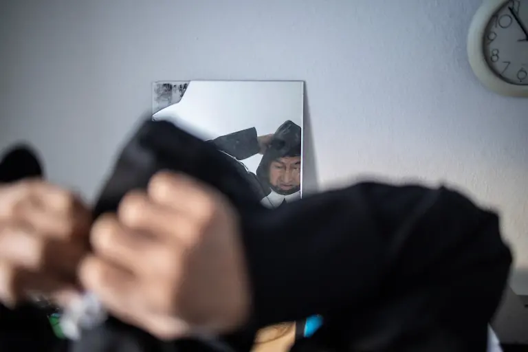 Village-catechist-Kaaleeraq-Ringsted-74-looks-at-himself-in-a-mirror-as-he-puts-on-his-liturgical-vestments-inside-the-church-in-Kapisillit-Greenland-January-20-2026-The-concept-that-ownership-is-shared-collectively-is-central-to-the-Inuit-identity-It-has-survived-300-years-of-colonisation-and-is-written-into-law-People-can-own-houses-but-not-the-land-beneath-them-We-can-t-even-buy-our-own-land-ourselves-but-Trump-wants-to-buy-it-that-s-so-strange-to-us-said-Ringsted-REUTERS-Marko-Djurica-SEARCH-DJURICA-GREENLAND-INUIT-FOR-THIS-STORY-SEARCH-WIDER-IMAGE-FOR-ALL-STORIES