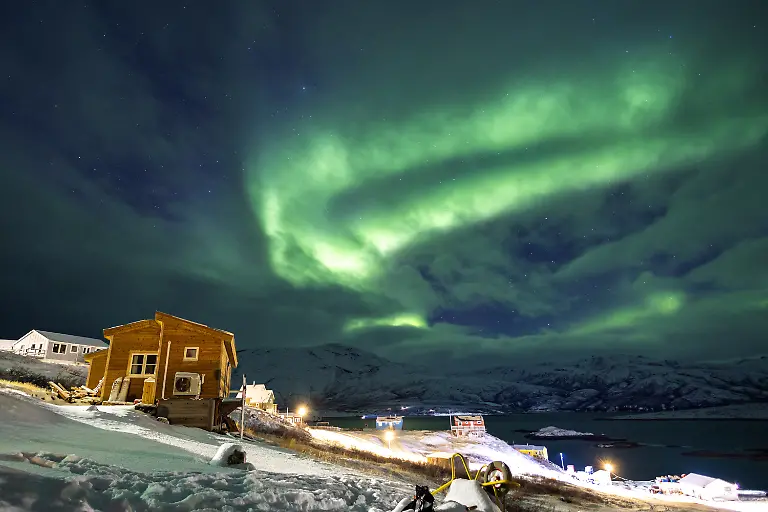 The-Aurora-Borealis-also-known-as-the-northern-lights-illuminates-the-sky-over-houses-in-Kapisillit-Greenland-January-20-2026-The-concept-that-ownership-is-shared-collectively-is-central-to-the-Inuit-identity-It-has-survived-300-years-of-colonisation-and-is-written-into-law-People-can-own-houses-but-not-the-land-beneath-them-We-can-t-even-buy-our-own-land-ourselves-but-Trump-wants-to-buy-it-that-s-so-strange-to-us-said-village-catechist-Kaaleeraq-Ringsted-74-REUTERS-Marko-Djurica-SEARCH-DJURICA-GREENLAND-INUIT-FOR-THIS-STORY-SEARCH-WIDER-IMAGE-FOR-ALL-STORIES