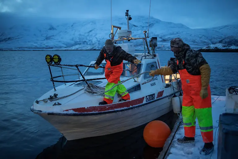 Fisherman-Aslak-Wilhelm-Jensen-50-docks-his-boat-after-a-day-of-fishing-in-Kapisillit-Greenland-January-20-2026-People-here-are-interested-in-the-day-that-is-coming-Is-there-food-in-the-fridge-Fine-then-I-can-sleep-a-little-longer-If-there-is-no-food-then-I-will-go-out-and-catch-fish-or-go-out-and-shoot-a-reindeer-said-Vanilla-Mathiassen-a-Danish-teacher-in-Kapisillit-who-has-worked-in-towns-and-villages-across-Greenland-for-13-years-REUTERS-Marko-Djurica-SEARCH-DJURICA-GREENLAND-INUIT-FOR-THIS-STORY-SEARCH-WIDER-IMAGE-FOR-ALL-STORIES