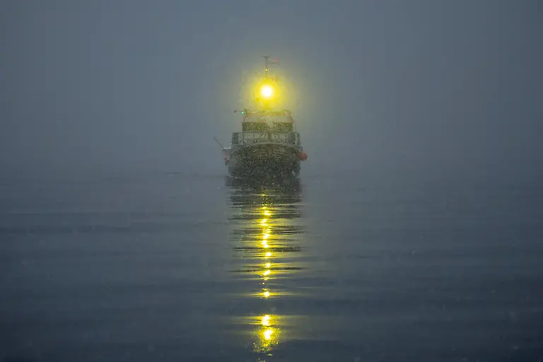 A-fishing-boat-sails-in-Kapisillit-Greenland-January-19-2026-People-here-are-interested-in-the-day-that-is-coming-Is-there-food-in-the-fridge-Fine-then-I-can-sleep-a-little-longer-If-there-is-no-food-then-I-will-go-out-and-catch-fish-or-go-out-and-shoot-a-reindeer-said-Vanilla-Mathiassen-a-Danish-teacher-in-Kapisillit-who-has-worked-in-towns-and-villages-across-Greenland-for-13-years-REUTERS-Marko-Djurica-SEARCH-DJURICA-GREENLAND-INUIT-FOR-THIS-STORY-SEARCH-WIDER-IMAGE-FOR-ALL-STORIES