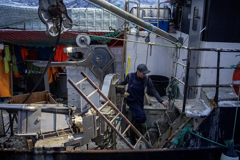 A-fisherman-walks-on-his-boat-docked-in-Kapisillit-Greenland-January-20-2026-People-here-are-interested-in-the-day-that-is-coming-Is-there-food-in-the-fridge-Fine-then-I-can-sleep-a-little-longer-If-there-is-no-food-then-I-will-go-out-and-catch-fish-or-go-out-and-shoot-a-reindeer-said-Vanilla-Mathiassen-a-Danish-teacher-in-Kapisillit-who-has-worked-in-towns-and-villages-across-Greenland-for-13-years-REUTERS-Marko-Djurica-SEARCH-DJURICA-GREENLAND-INUIT-FOR-THIS-STORY-SEARCH-WIDER-IMAGE-FOR-ALL-STORIES