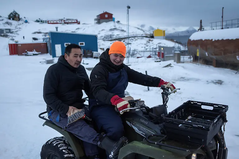 Villagers-ride-on-a-quad-bike-in-Kapisillit-Greenland-January-20-2026-People-here-are-interested-in-the-day-that-is-coming-Is-there-food-in-the-fridge-Fine-then-I-can-sleep-a-little-longer-If-there-is-no-food-then-I-will-go-out-and-catch-fish-or-go-out-and-shoot-a-reindeer-said-Vanilla-Mathiassen-a-Danish-teacher-in-Kapisillit-who-has-worked-in-towns-and-villages-across-Greenland-for-13-years-REUTERS-Marko-Djurica-SEARCH-DJURICA-GREENLAND-INUIT-FOR-THIS-STORY-SEARCH-WIDER-IMAGE-FOR-ALL-STORIES