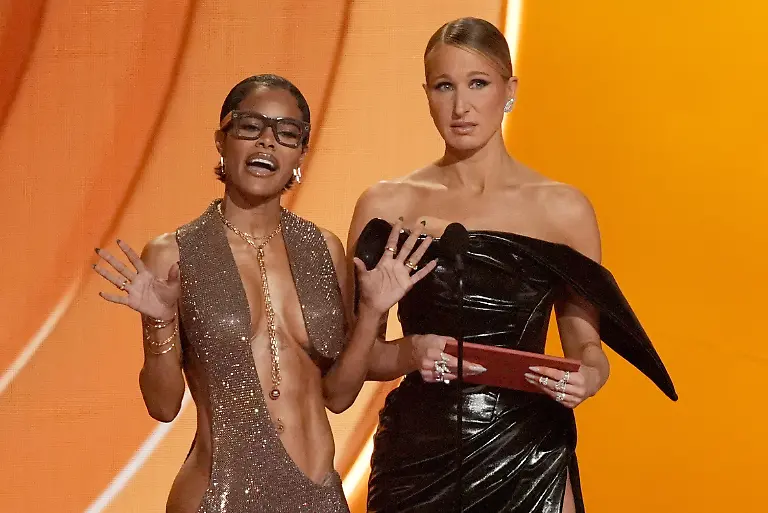 Teyana-Taylor-left-and-Nikki-Glaser-present-the-award-for-best-pop-vocal-album-during-the-68th-annual-Grammy-Awards-on-Sunday-Feb-1-2026-in-Los-Angeles