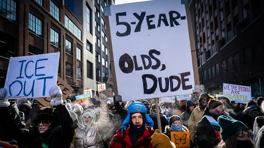 People-hold-signs-in-reference-to-five-year-old-Liam-Conejo-Ramos-who-was-held-by-immigration-officers-during-the-ICE-out-of-Minnesota-Day-of-Truth-and-Freedom-protest-in-Minneapolis-Minnesota-on-January-23-2026-The-Pentagon-has-ordered-1-500-US-soldiers-to-prepare-for-a-possible-deployment-to-a-state-roiled-by-unrest-over-an-immigration-crackdown-US-media-reported-on-January-18-The-reported-preparations-come-days-after-President-Donald-Trump-threatened-to-invoke-the-Insurrection-Act-which-enables-use-of-the-military-to-suppress-armed-rebellion-or-domestic-violence-although-a-day-later-he-said-there-was-no-immediate-need-for-it