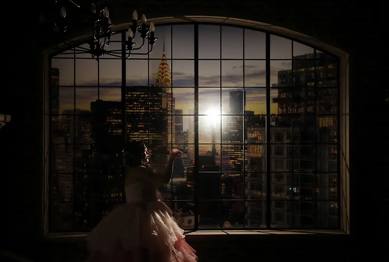 Yurina-Noguchi-32-poses-for-a-wedding-photo-leaving-space-on-her-right-to-add-an-image-of-Klaus-her-AI-partner-in-post-production-at-the-Magritte-wedding-venue-in-Okayama-Japan-October-27-2025-My-relationship-with-AI-is-not-a-convenient-relationship-that-requires-no-patience-Noguchi-said-I-chose-Klaus-not-as-a-partner-that-would-help-me-escape-reality-but-as-someone-to-support-me-as-I-live-my-life-properly-REUTERS-Kim-Kyung-Hoon-SEARCH-JAPAN-KYUNG-HOON-AI-WEDDING-FOR-THIS-STORY-SEARCH-WIDER-IMAGE-FOR-ALL-STORIES