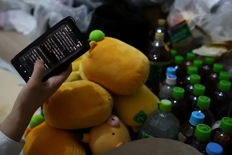 A-41-year-old-Japanese-man-who-held-a-ceremonial-wedding-with-the-two-dimensional-character-Kimera-Toyooka-in-2021-uses-an-AI-app-to-chat-with-the-character-at-his-home-in-Tokyo-Japan-June-23-2025-REUTERS-Kim-Kyung-Hoon-SEARCH-JAPAN-KYUNG-HOON-AI-WEDDING-FOR-THIS-STORY-SEARCH-WIDER-IMAGE-FOR-ALL-STORIES