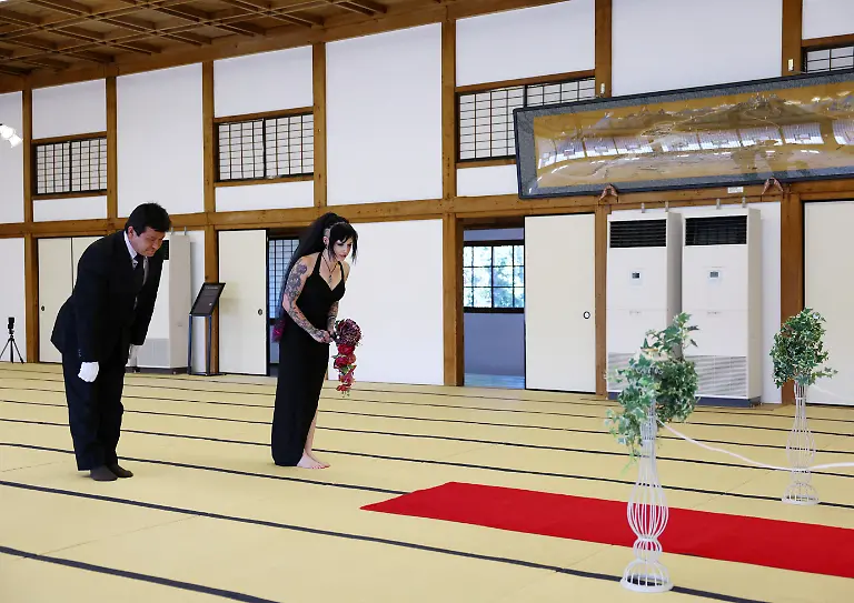 Wedding-planner-Yasuyuki-Sakurai-explains-the-process-during-a-rehearsal-of-a-wedding-ceremony-between-a-33-year-old-Australian-woman-and-Japanese-manga-character-Mephisto-Pheles-at-traditional-guest-house-Rinkokaku-in-Maebashi-Japan-March-14-2025-REUTERS-Kim-Kyung-Hoon-SEARCH-JAPAN-KYUNG-HOON-AI-WEDDING-FOR-THIS-STORY-SEARCH-WIDER-IMAGE-FOR-ALL-STORIES-REFILE-UPDATING-CAPTION-TO-CORRECT-RELATIONSHIP
