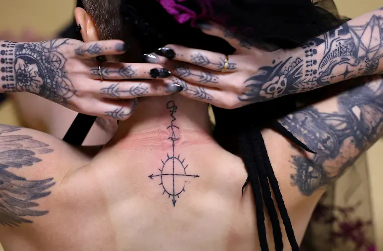 A-33-year-old-Australian-woman-shows-a-tattoo-symbolizing-Japanese-manga-character-Mephisto-Pheles-before-a-wedding-ceremony-at-traditional-guest-house-Rinkokaku-in-Maebashi-Japan-March-14-2025-REUTERS-Kim-Kyung-Hoon-SEARCH-JAPAN-KYUNG-HOON-AI-WEDDING-FOR-THIS-STORY-SEARCH-WIDER-IMAGE-FOR-ALL-STORIES-REFILE-UPDATING-CAPTION-TO-CORRECT-RELATIONSHIP