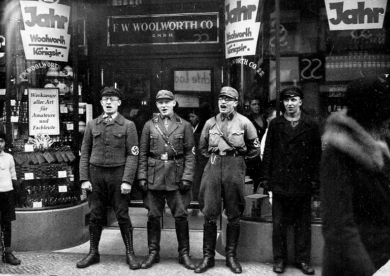 Nazi-troops-sing-in-front-of-the-Berlin-branch-of-the-Woolworth-Co-store-during-the-movement-to-boycott-Jewish-presence-in-Germany-in-March-1933-The-Hitlerites-believe-the-founder-of-the-Woolworth-Co-was-Jewish