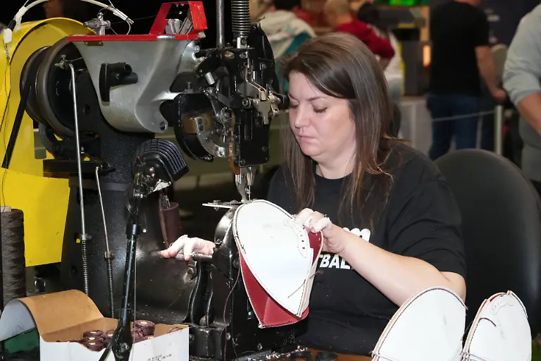NFL-American-Football-Herren-USA-Super-Bowl-LX-Experience-Feb-4-2026-San-Francisco-CA-USA-A-woman-sews-a-football-at-the-Wilson-Sporting-Goods-exhibit-at-the-Super-Bowl-LX-Experience-at-the-Moscone-Center