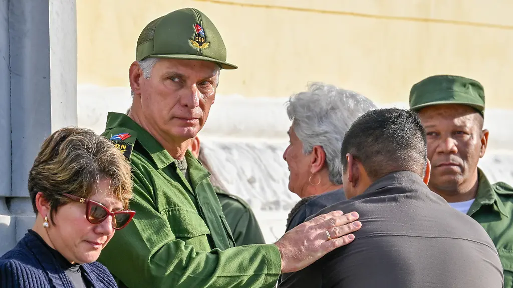 Cuban-President-Miguel-Diaz-Canel-accompanied-by-his-wife-first-lady-Lis-Cuesta-Peraza-de-Diaz-Canel-greets-relatives-of-Cuban-officers-killed-during-a-U-S-operation-in-Venezuela-that-captured-President-Nicolas-Maduro-during-the-funeral-in-Havana-Cuba-Friday-Jan-16-2026