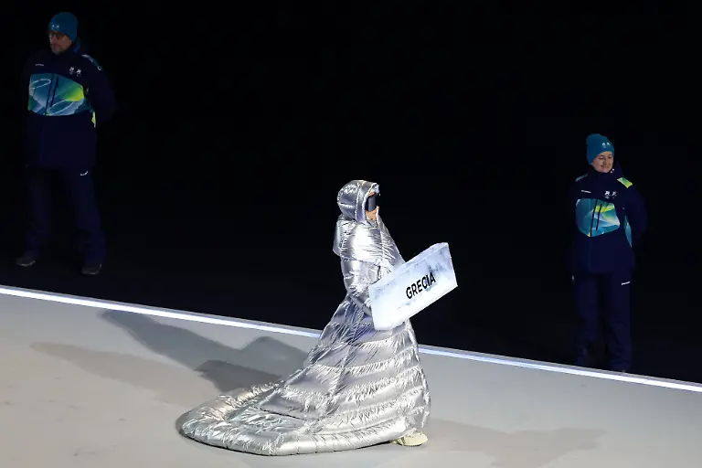 Feb-6-2026-Milan-ITALY-The-sign-holder-for-Greece-during-the-Opening-Ceremony-for-the-Milano-Cortina-2026-Olympic-Winter-Games-at-Milano-San-Siro-Olympic-Stadium