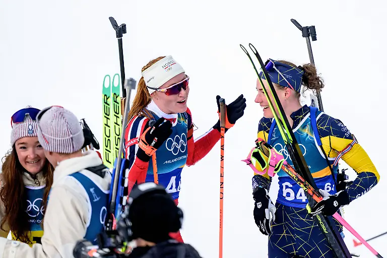260208-Maren-Kirkeeide-of-Norway-and-Hanna-Oeberg-of-Sweden-after-competing-in-biathlon-mixed-relay-during-day-2-of-the-2026-Winter-Olympics-on-February-8-2026-in-Anterselva