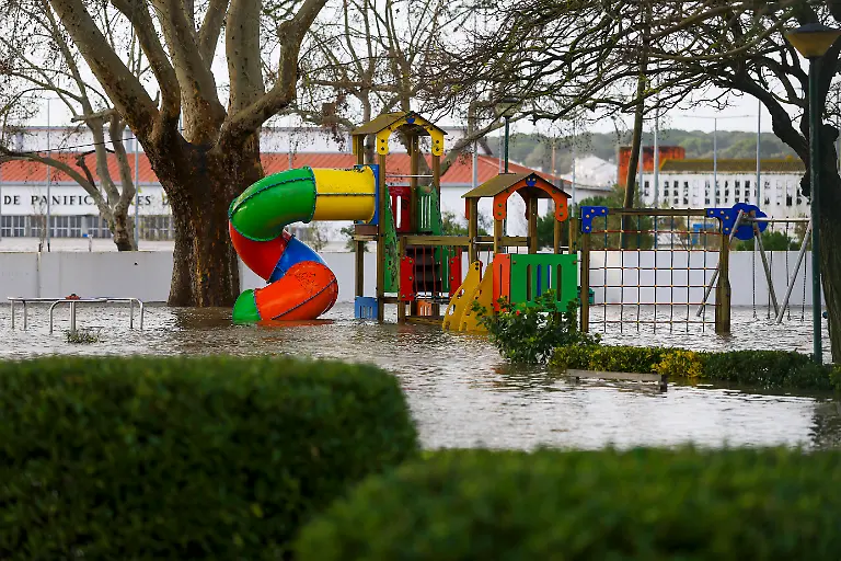 Floodwaters-cover-a-playground-ib-Alcacer-do-Sal-south-of-Portugal-amid-Storm-Leonardo-on-February-5-2026-Spain-on-February-5-2026-lifted-its-highest-weather-alert-for-torrential-rain-in-the-southern-region-of-Andalusia-where-a-woman-went-missing-a-day-after-the-storm-killed-one-in-Portugal-Storm-Leonardo-dumped-more-than-40-centimetres-15-inches-of-rain-in-some-Andalusian-districts-on-February-4-the-equivalent-of-several-months-of-precipitation-forcing-the-evacuation-of-thousands-paralysing-rail-and-road-transport-and-shutting-schools-The-downpours-came-after-a-storm-killed-five-people-injured-hundreds-and-left-tens-of-thousands-without-power-in-neighbouring-Portugal-last-week
