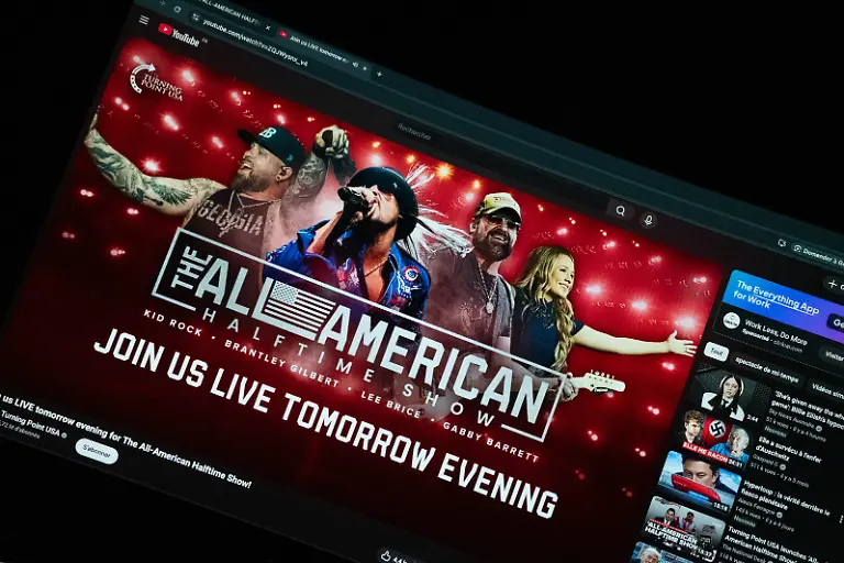 Illustration-of-the-All-American-Halftime-Show-website-and-social-media-In-response-to-the-Super-Bowl-halftime-show-featuring-Bad-Bunny-and-the-opening-performance-by-Green-Day-two-artists-openly-critical-of-Donald-Trump-the-conservative-camp-is-organizing-an-alternative-titled-the-All-American-Halftime-Show-Hosted-by-the-organization-Turning-Point-USA-this-counter-event-features-a-country-leaning-lineup-to-compete-with-the-official-billing-The-concert-will-bring-together-committed-figures-such-as-Kid-Rock-Brantley-Gilbert-Gabby-Barrett-and-Lee-Brice-to-offer-a-musical-alternative-aligned-with-the-values-of-the-former-president-s-supporters-Paris-France-on-February-8-2026-Photo-by-Christopher-Charpaud-ABACAPRESS-COM