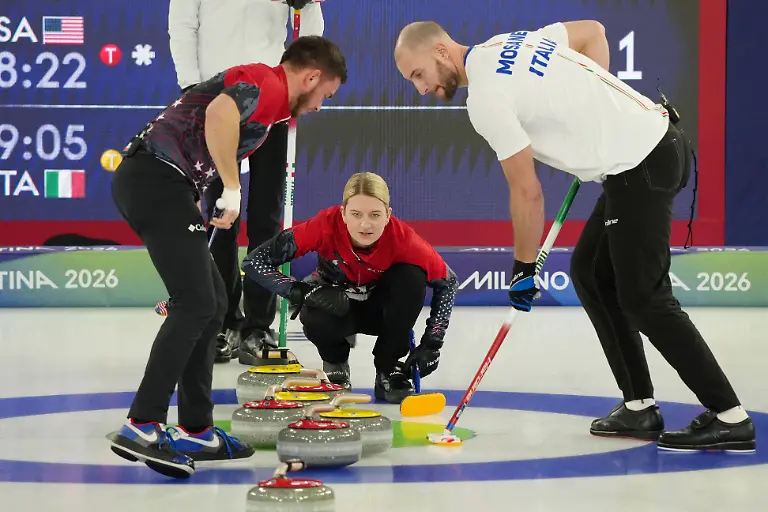 Olympics-Curling-Mixed-Doubles-Round-Robin-Feb-9-2026-Cortina-d-Ampezzo-Italy-Korey-Dropkin-and-Cory-Thiesse-of-Team-United-States-work-on-the-ice-against-Amos-Mosaner-of-Team-Italy-during-a-curling-mixed-doubles-match-during-the-Milano-Cortina-2026-Olympic-Winter-games-Winterspiele-Spiele-Summer-games-at-Cortina-Curling-Olympic-Stadium
