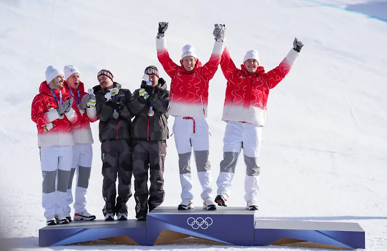 260209-BORMIO-Feb-9-2026-Gold-medalists-Franjo-von-Allmen-1st-R-Tanguy-Nef-of-Switzerland-2-and-silver-medalists-Marco-Odermatt-2nd-L-Loic-Meillard-of-Switzerland-1-and-Vincent-Kriechmayr-3rd-R-Manuel-Feller-of-Austria-1-attend-the-awarding-ceremony-of-the-alpine-skiing-men-s-team-combined-at-the-Milan-Cortina-2026-Olympic-Winter-Games-in-Bormio-Italy-Feb-9-2026