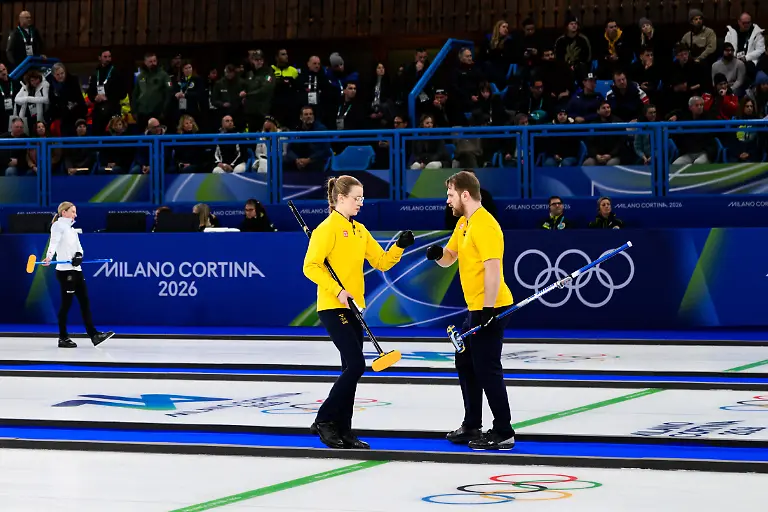 260209-Isabelle-Wrana-and-Rasmus-Wrana-of-Sweden-competes-in-a-round-robin-mixed-doubles-curling-semifinal-match-between-Great-Britain-and-Sweden-during-day-3-of-the-2026-Winter-Olympics-on-February-9-2026-in-Cortina