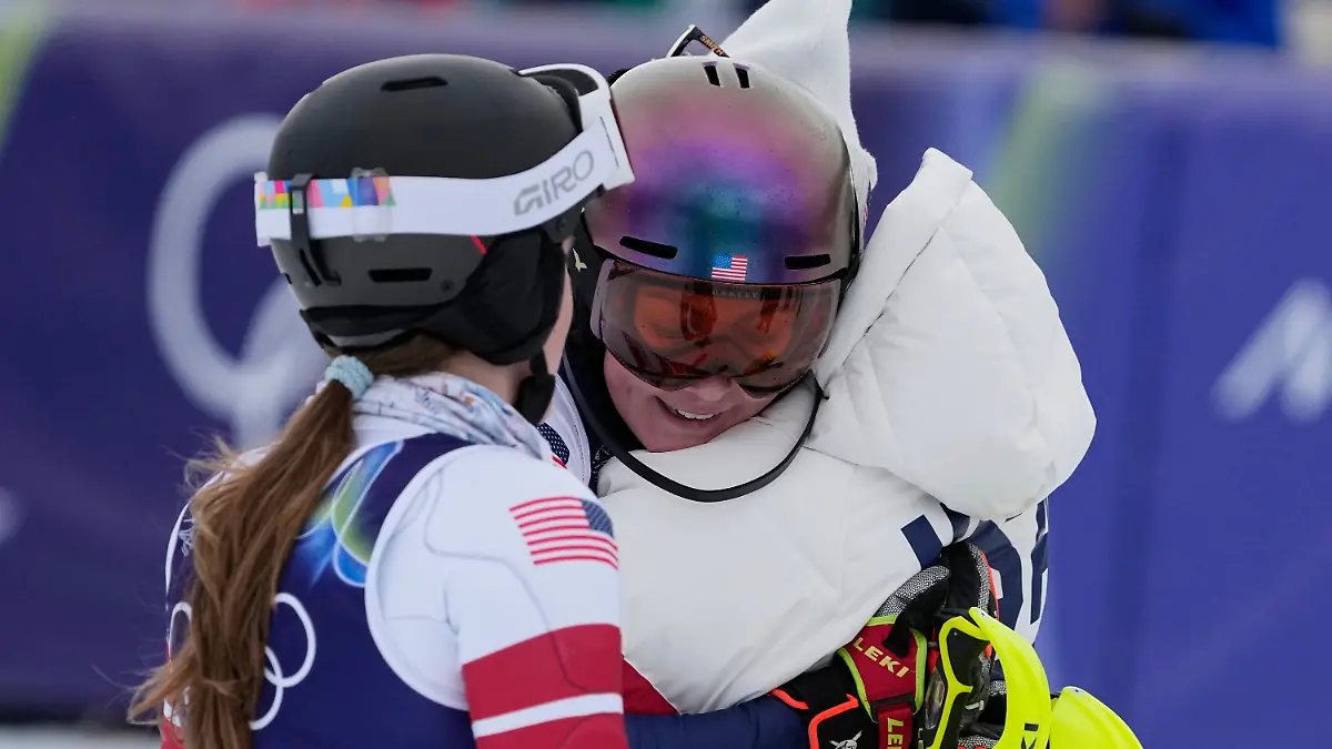 United-States-Mikaela-Shiffrin-center-is-hugged-by-United-States-Jacqueline-Wiles-as-United-States-Paula-Moltzan-left-looks-on-at-the-finish-area-of-an-alpine-ski-women-s-team-combined-race-at-the-2026-Winter-Olympics-in-Cortina-d-Ampezzo-Italy-Tuesday-Feb-10-2026