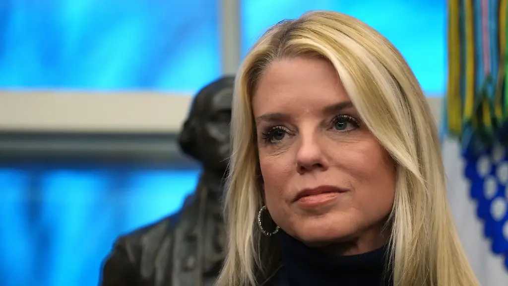 Attorney-General-Pam-Bondi-listens-as-President-Donald-Trump-speaks-at-an-event-on-addiction-recovery-in-the-Oval-Office-of-the-White-House-Thursday-Jan-29-2026-in-Washington