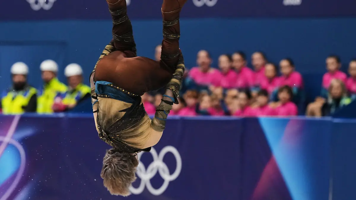 Ilia-Malinin-of-the-United-States-does-a-back-flip-while-competing-during-the-men-s-figure-skating-short-program-at-the-2026-Winter-Olympics-in-Milan-Italy-Tuesday-Feb-10-2026