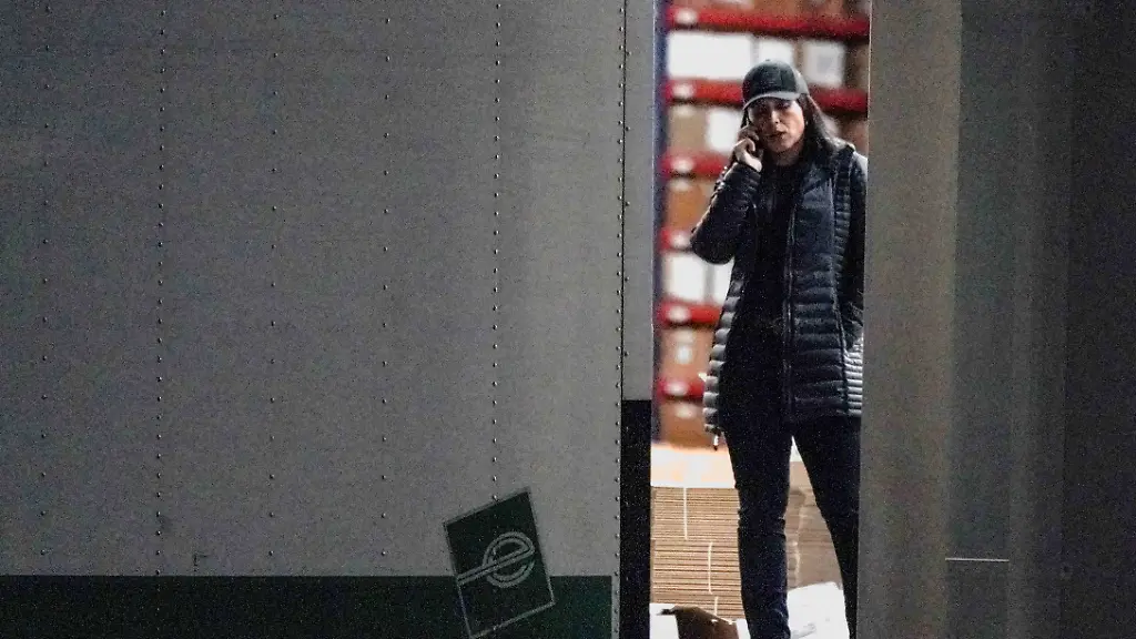 FILE-PHOTO-United-States-Director-of-National-Intelligence-Tulsi-Gabbard-speaks-on-the-phone-while-standing-at-the-edge-of-a-truck-loading-bay-after-the-Federal-Bureau-of-Investigation-FBI-executed-a-search-warrant-for-the-Fulton-County-Election-Hub-and-Operation-Center-in-relation-to-the-2020-election-according-to-a-law-enforcement-official-familiar-with-the-matter-in-Union-City-Georgia-U-S-January-28-2026-REUTERS-Elijah-Nouvelage