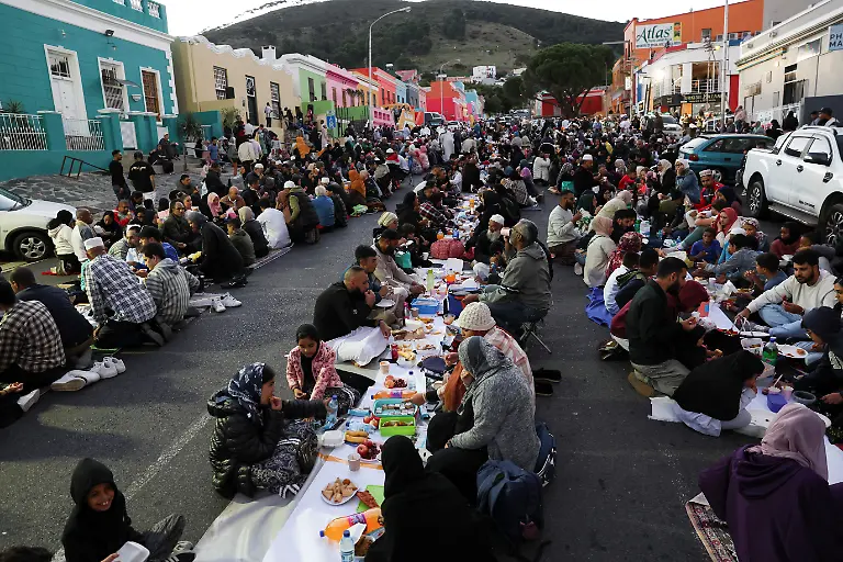 Muslims-eat-at-a-mass-Iftar-breaking-of-the-fast-during-the-holy-month-of-Ramadan-in-Bo-Kaap-Cape-Town-South-Africa-March-31-2023