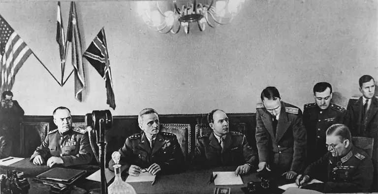 Soviet-Marshal-Georgy-Zhukov-L-US-Air-Force-General-Carl-A-Spaatz-2nd-L-and-French-General-Jean-de-Latrre-de-Tassigny-3rd-L-watch-Field-Marshal-Wilhelm-Keitel-R-signing-the-act-of-unconditional-capitulation-of-Nazi-Germany-in-Karlhorst-Berlin-in-1945-PUBLICATIONxINxGERxAUTxONLY-TASS-268049-Soviet-Marshal-Georgy-Zhukov-l-U-S