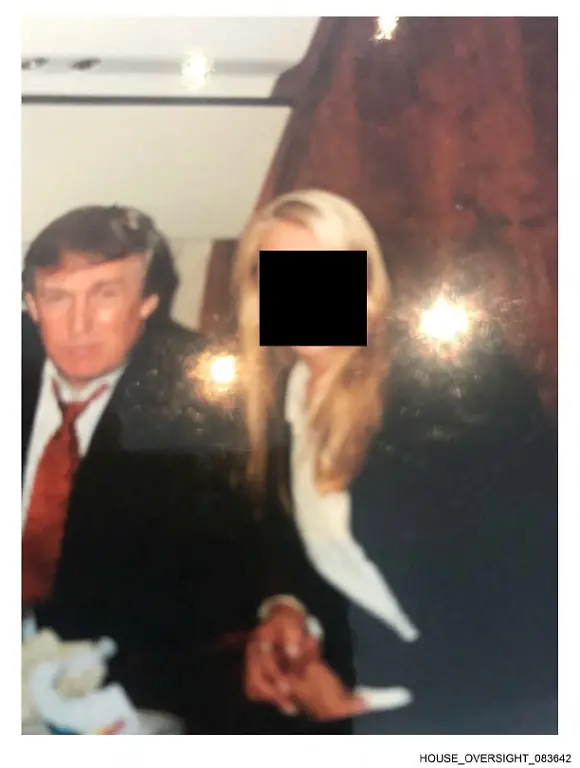 U-S-President-Donald-Trump-is-seen-with-an-unidentified-woman-in-this-handout-image-from-the-estate-of-the-late-financier-and-convicted-sex-offender-Jeffrey-Epstein-released-by-Democrats-on-the-House-Oversight-Committee-in-Washington-D-C-U-S-on-December-12-2025-House-Oversight-Committee-Democrats-Handout-via-REUTERS-THIS-IMAGE-HAS-BEEN-SUPPLIED-BY-A-THIRD-PARTY-REDACTED-AREA-FROM-SOURCE