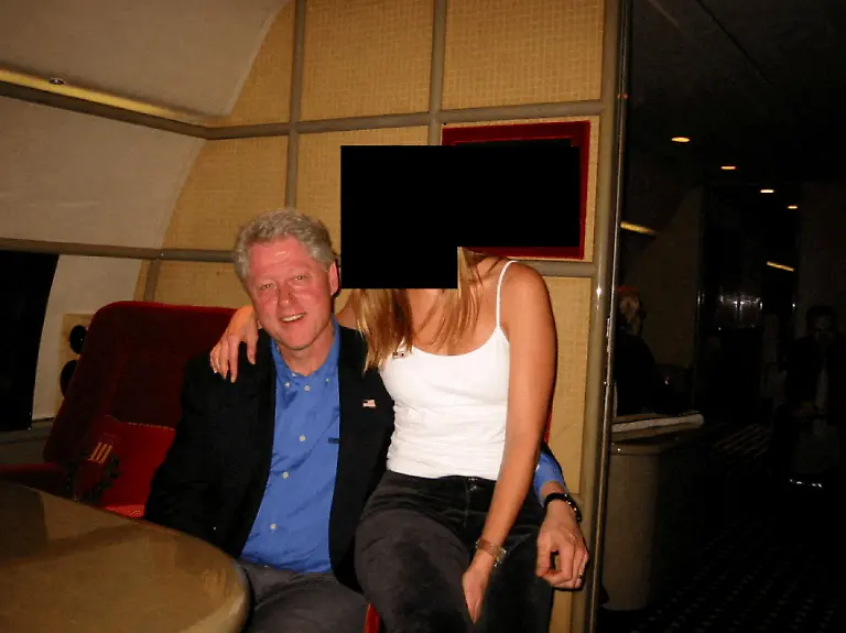 Former-U-S-President-Bill-Clinton-and-a-woman-are-seen-in-this-image-from-the-estate-of-late-financier-and-convicted-sex-offender-Jeffrey-Epstein-released-by-the-Department-of-Justice-in-Washington-D-C-U-S-on-December-19-2025-U-S-Justice-Department-Handout-via-REUTERS-THIS-IMAGE-HAS-BEEN-SUPPLIED-BY-A-THIRD-PARTY-REDACTED-AREAS-FROM-SOURCE-TPX-IMAGES-OF-THE-DAY-THIS-PICTURE-WAS-PROCESSED-BY-REUTERS-TO-ENHANCE-QUALITY-AN-UNPROCESSED-VERSION-HAS-BEEN-PROVIDED-SEPARATELY