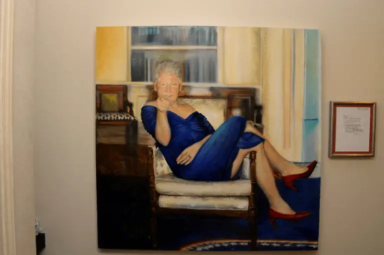 A-painting-of-former-U-S-President-Bill-Clinton-wearing-a-dress-is-displayed-inside-the-Manhattan-home-of-Jeffrey-Epstein-in-this-image-from-the-estate-of-late-financier-and-convicted-sex-offender-Jeffrey-Epstein-released-by-the-Department-of-Justice-in-Washington-D-C-U-S-on-December-19-2025-U-S-Justice-Department-Handout-via-REUTERS-THIS-IMAGE-HAS-BEEN-SUPPLIED-BY-A-THIRD-PARTY-TPX-IMAGES-OF-THE-DAY-THIS-PICTURE-WAS-PROCESSED-BY-REUTERS-TO-ENHANCE-QUALITY-AN-UNPROCESSED-VERSION-HAS-BEEN-PROVIDED-SEPARATELY
