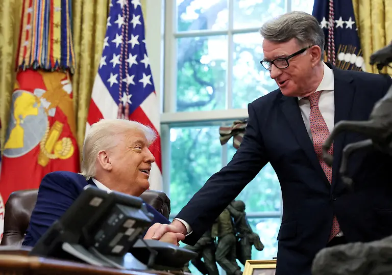 FILE-PHOTO-U-S-President-Donald-Trump-shakes-hands-with-Britain-s-ambassador-to-the-United-States-Peter-Mandelson-after-announcing-a-trade-deal-with-the-U-K-in-the-Oval-Office-at-the-White-House-in-Washington-D-C-U-S-May-8-2025