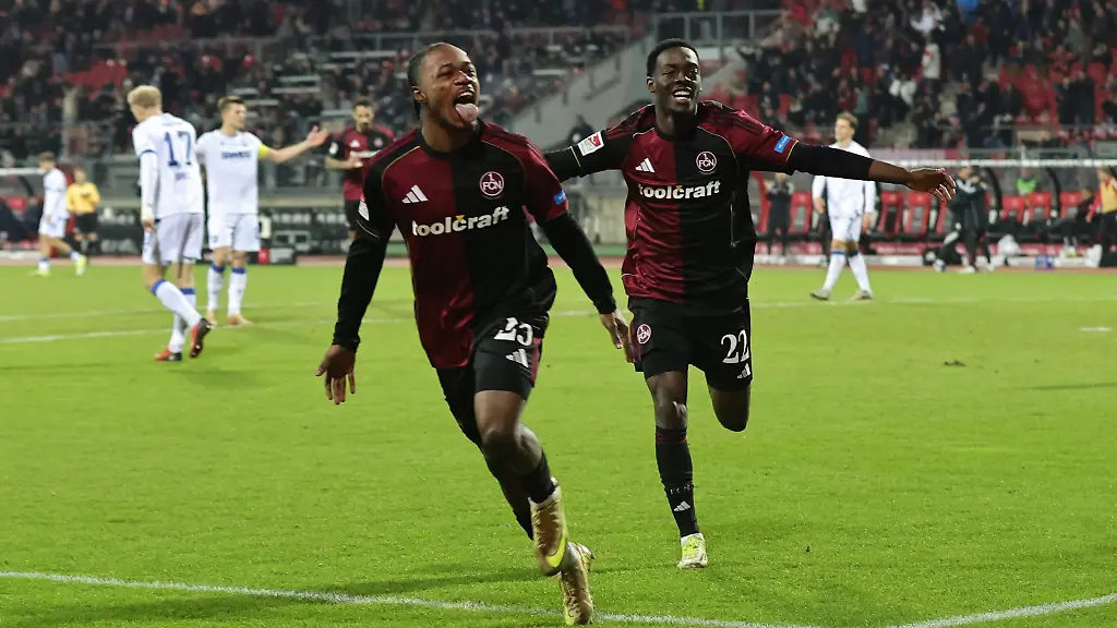 13-02-2026-Fussball-Saison-2025-2026-2-Fussball-Bundesliga-22-Spieltag-1-FC-Nuernberg-FCN-Club-Karlsruher-SC-KSC-Foto-Sportfoto-Zink-DaMa-xdaxmax-DFL-regulations-prohibit-any-use-of-photographs-as-image-sequences-and-or-quasi-video-only-for-editorial-use-Jubel-Freude-Torjubel-nach-Tor-zum-4-0-Mohamed-Ali-Zoma-23-1-FC-Nuernberg-FCN-Rabby-Nzingoula-22-1-FC-Nuernberg-FCN-jubelt-freut-sich-Torschuetze-Mohamed-Ali-Zoma-23-1