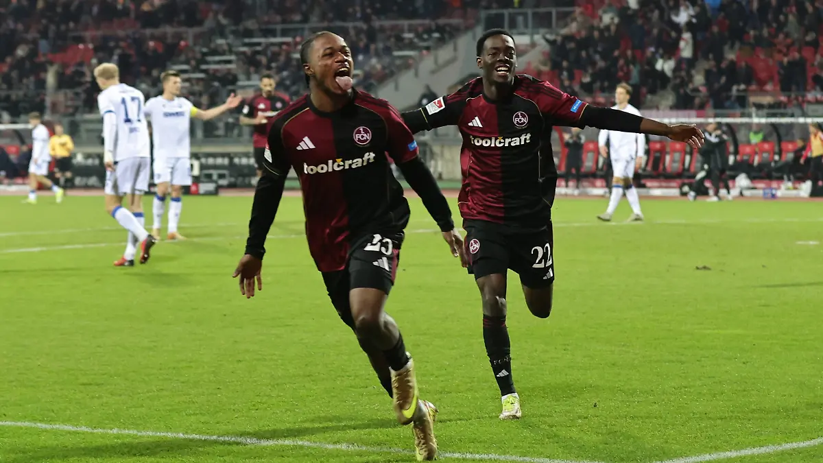 13-02-2026-Fussball-Saison-2025-2026-2-Fussball-Bundesliga-22-Spieltag-1-FC-Nuernberg-FCN-Club-Karlsruher-SC-KSC-Foto-Sportfoto-Zink-DaMa-xdaxmax-DFL-regulations-prohibit-any-use-of-photographs-as-image-sequences-and-or-quasi-video-only-for-editorial-use-Jubel-Freude-Torjubel-nach-Tor-zum-4-0-Mohamed-Ali-Zoma-23-1-FC-Nuernberg-FCN-Rabby-Nzingoula-22-1-FC-Nuernberg-FCN-jubelt-freut-sich-Torschuetze-Mohamed-Ali-Zoma-23-1