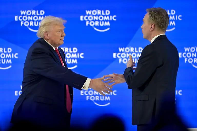 US-President-Donald-Trump-left-shakes-hands-with-Norwegian-Borge-Brende-President-and-CEO-of-the-World-Economic-Forum-right-at-the-56th-annual-meeting-of-the-World-Economic-Forum-WEF-in-Davos-Switzerland-Wednesday-January-21-2026-The-meeting-under-the-topic-A-Spirit-of-Dialogue-brings-together-entrepreneurs-scientists-corporate-and-political-leaders-in-Davos-and-takes-place-from-January-19-to-23-in-Davos